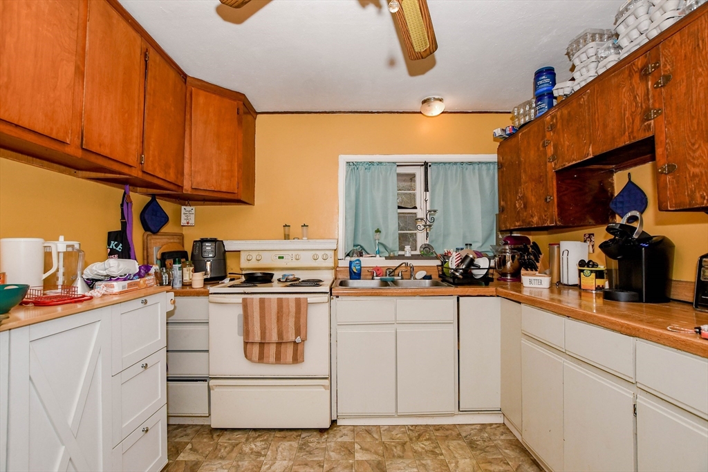 6 Gilbert Way Wareham, MA 02571 - Photo 5 of 42 a kitchen with stainless steel appliances granite countertop a stove a sink and a refrigerator