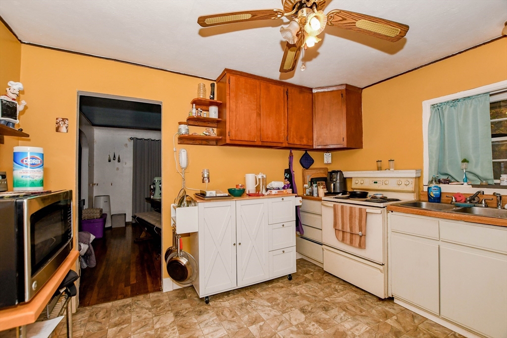 6 Gilbert Way Wareham, MA 02571 - Photo 6 of 42 a kitchen with a stove a sink and a refrigerator