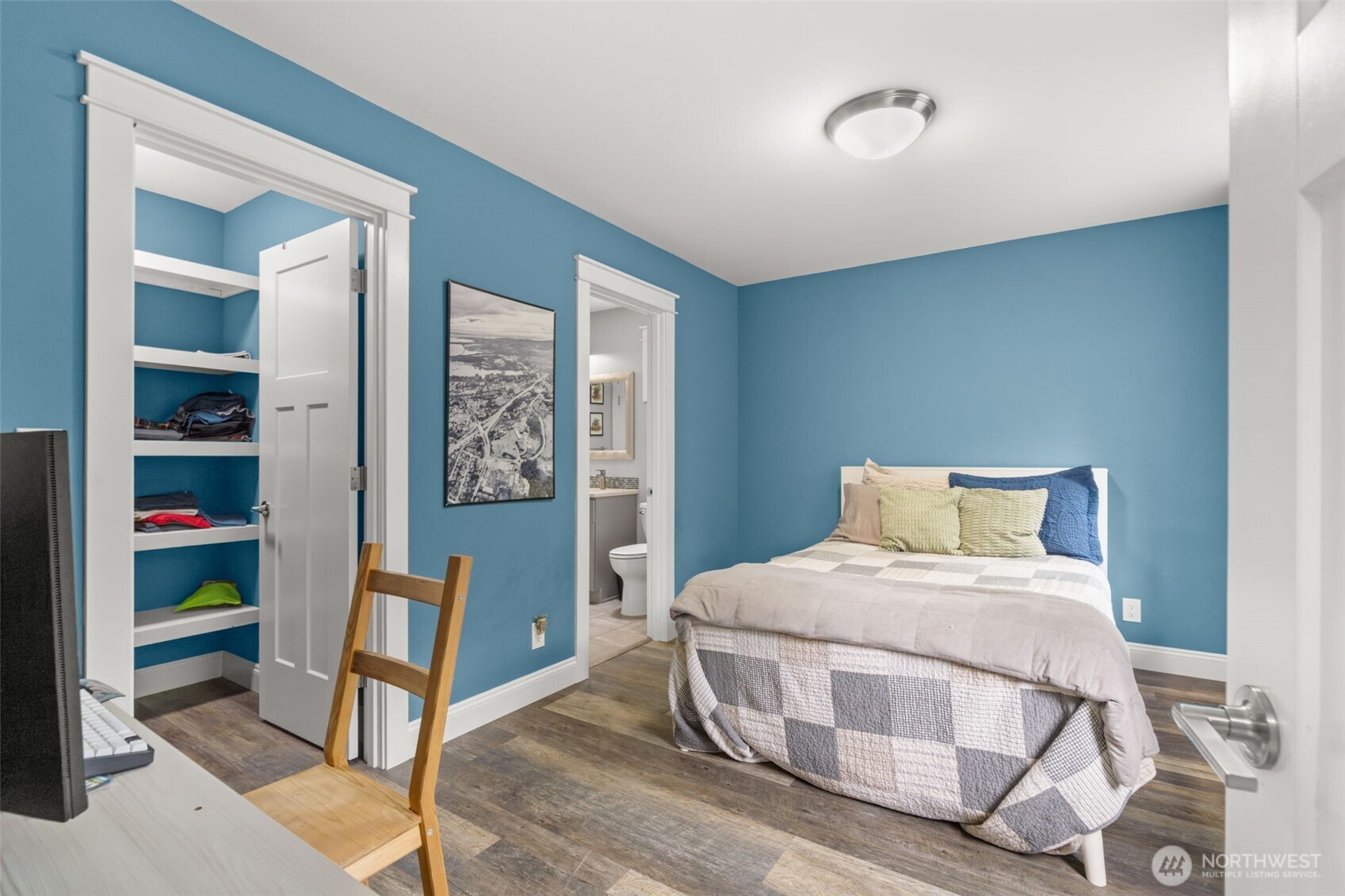 9916 Dishman Road Northwest Bremerton, WA 98312 - Photo 28 of 40 a bedroom with a bed and a table in it