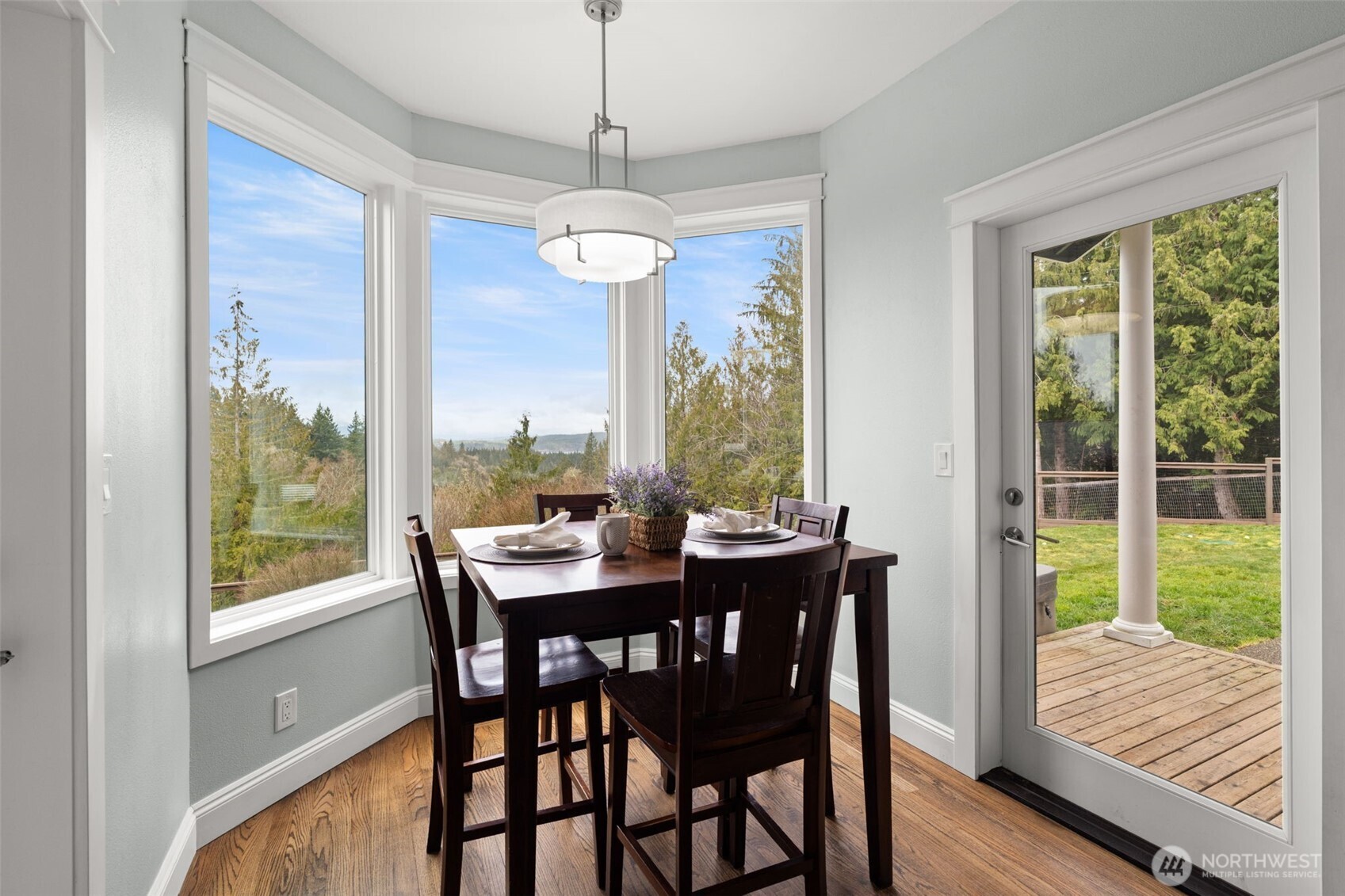 9916 Dishman Road Northwest Bremerton, WA 98312 - Photo 9 of 40 a view of a dining room with furniture window and wooden floor