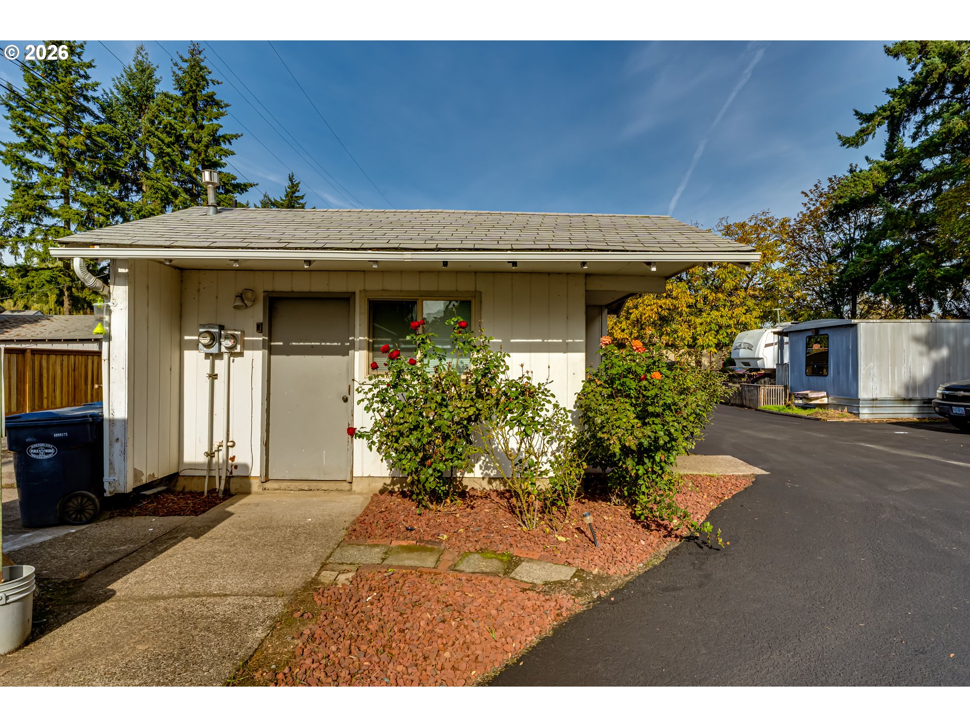 351 Front Street Junction City, OR 97448 - Photo 21 of 29 a view of a house with potted plants and a large tree