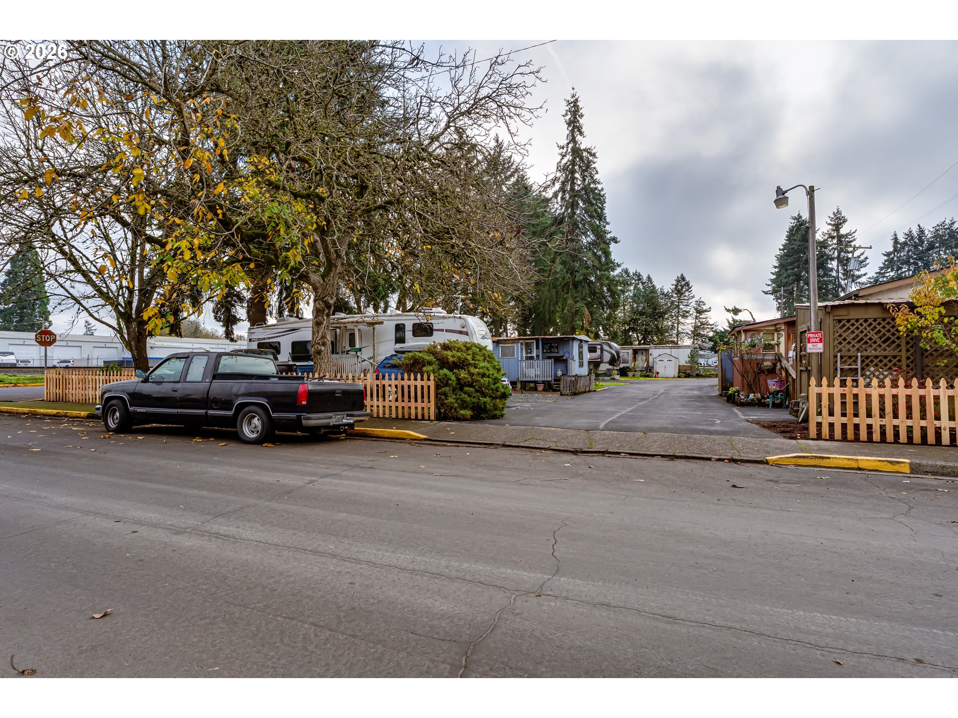 351 Front Street Junction City, OR 97448 - Photo 27 of 29 a view of road with card parked on side and retail shops