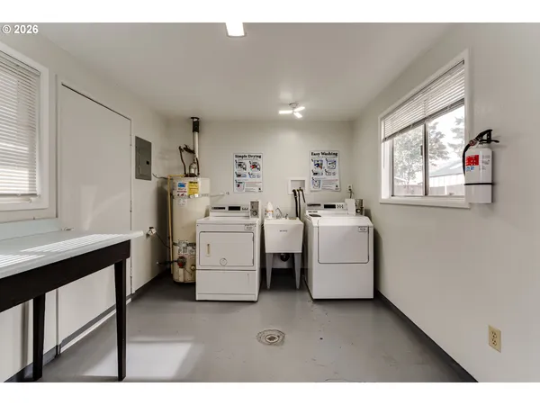 a utility room with dryer and washer