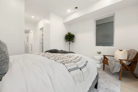 a workspace room with furniture and wooden floor