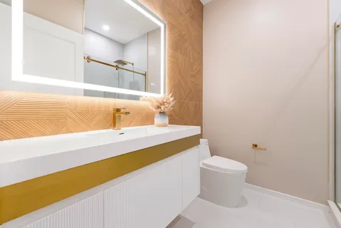 a bathroom with a sink vanity and a mirror