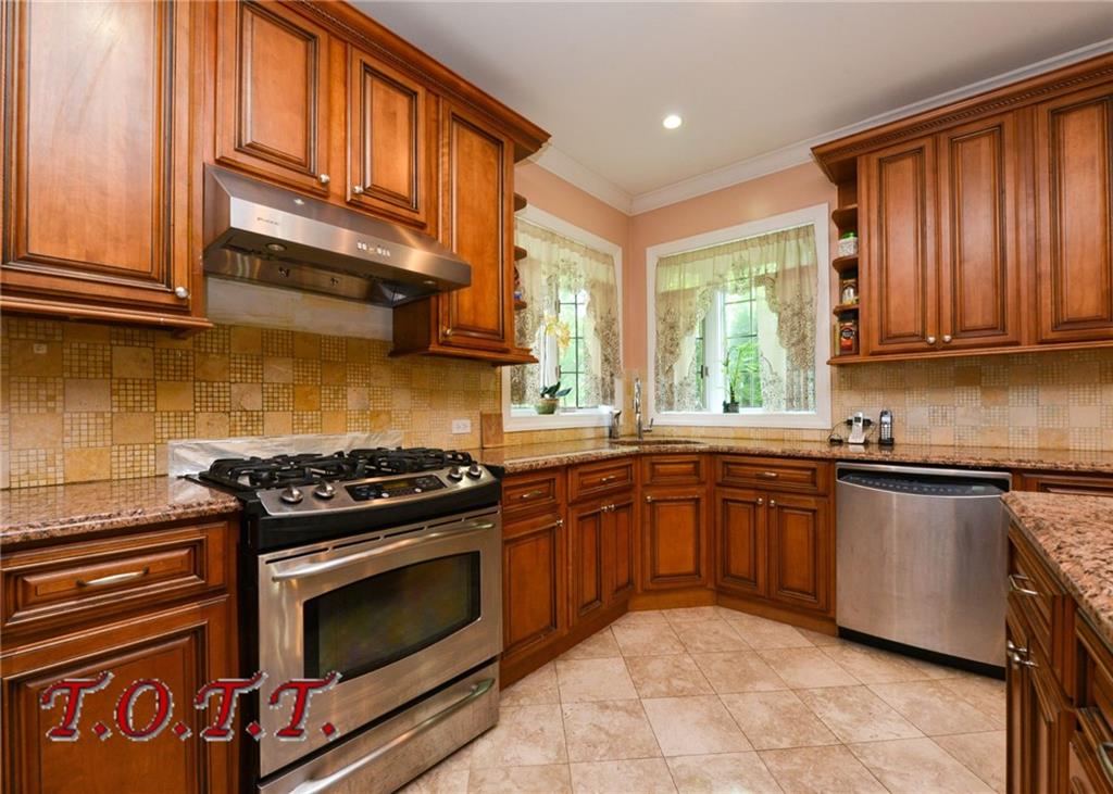 11 Bell Point Drive Brooklyn, NY 11234 - Photo 15 of 30 a kitchen with stainless steel appliances granite countertop a stove sink and cabinets