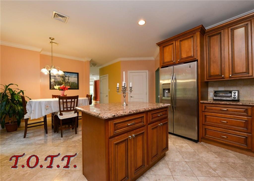 11 Bell Point Drive Brooklyn, NY 11234 - Photo 17 of 30 a kitchen with stainless steel appliances granite countertop a sink and a refrigerator