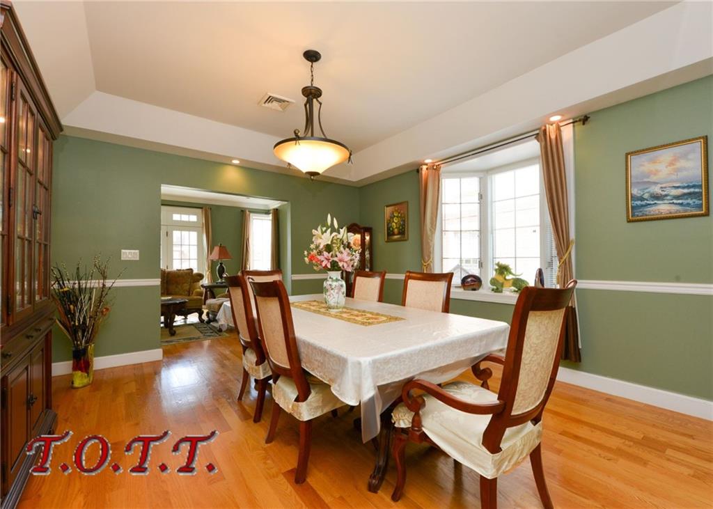11 Bell Point Drive Brooklyn, NY 11234 - Photo 22 of 30 a view of a dining room with furniture window and wooden floor