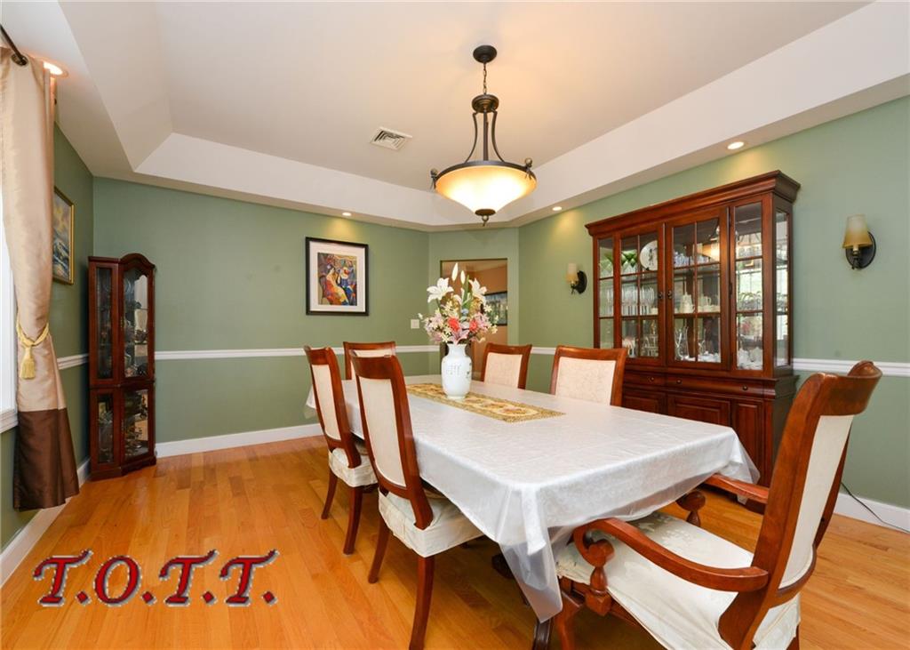 11 Bell Point Drive Brooklyn, NY 11234 - Photo 23 of 30 a view of a dining room with furniture window and wooden floor