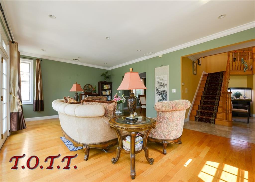11 Bell Point Drive Brooklyn, NY 11234 - Photo 24 of 30 a living room with furniture a window and a table