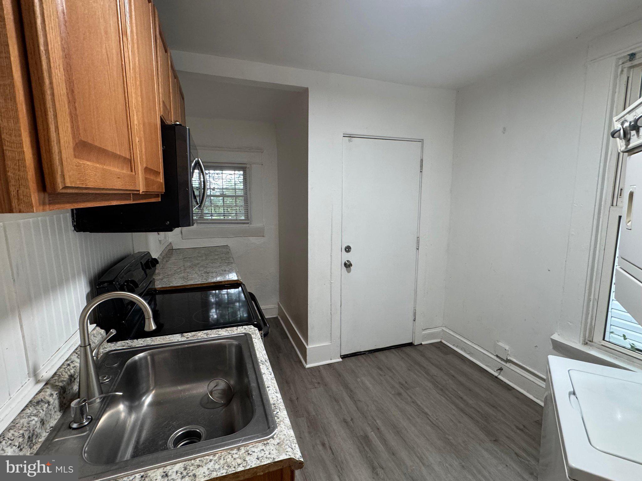 707 Denison Street Baltimore, MD 21229 - Photo 9 of 18 Bright and functional kitchen space.