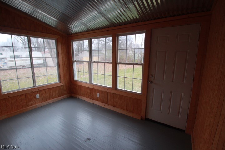 3606 Shelby Road Youngstown, OH 44511 - Photo 10 of 33 Unfurnished sunroom with lofted ceiling and a healthy amount of sunlight