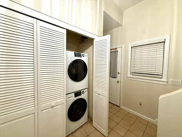 a view of a hallway with washer and dryer