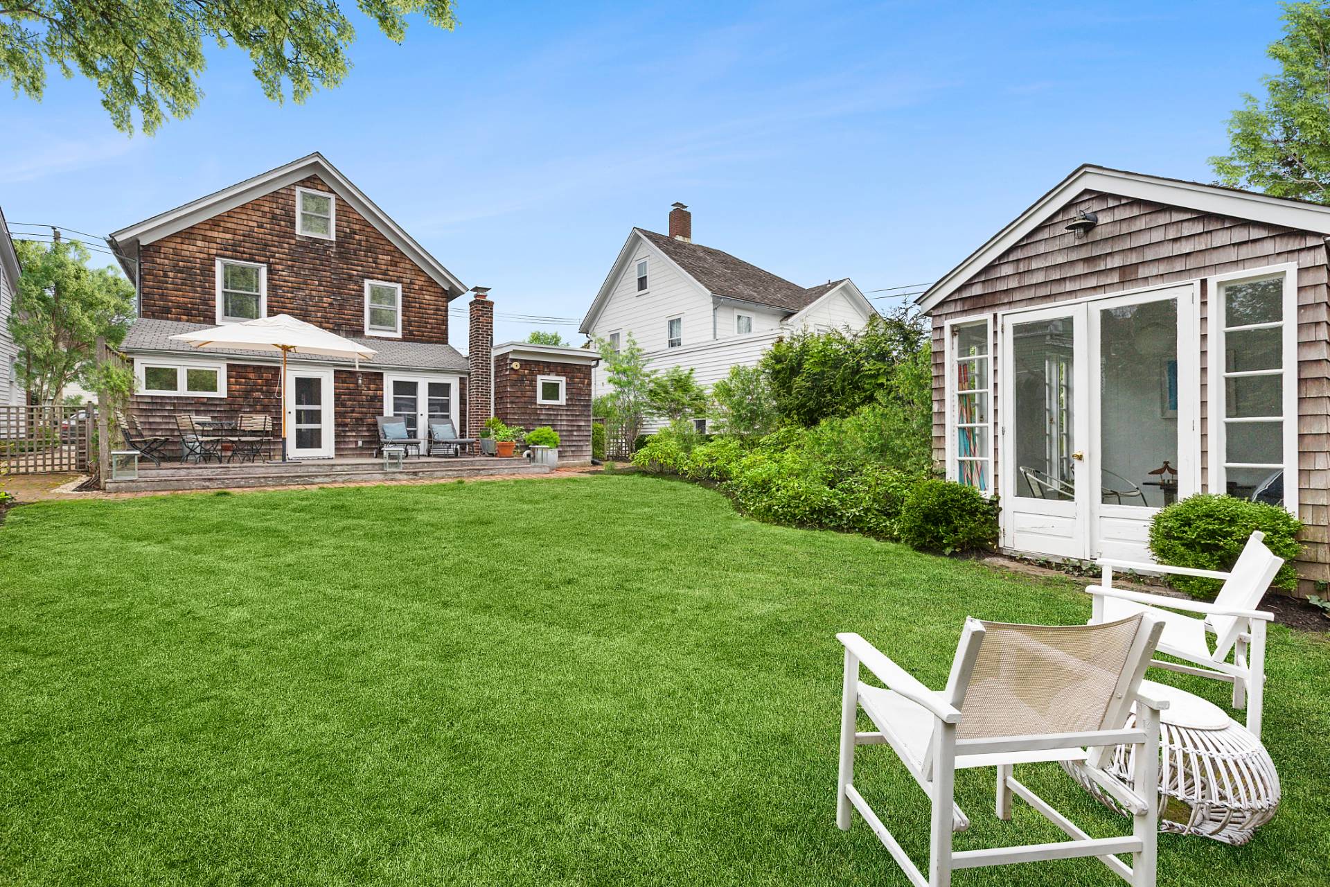 a front view of house with yard and green space
