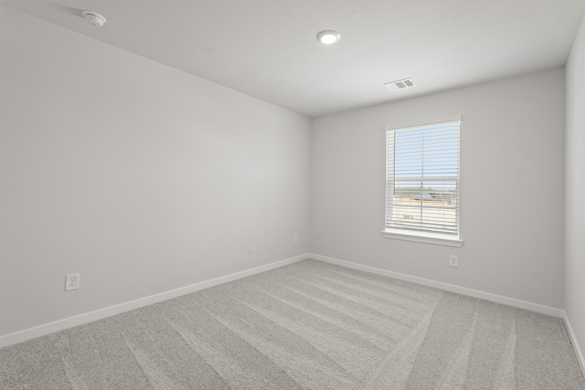 217 Spring Drive Hockley, TX 77447 - Photo 19 of 27 an empty room with a window