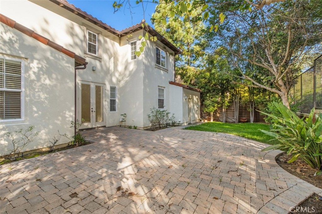 72 Clouds View Irvine, CA 92603 - Photo 29 of 43 a view of a brick building next to a yard