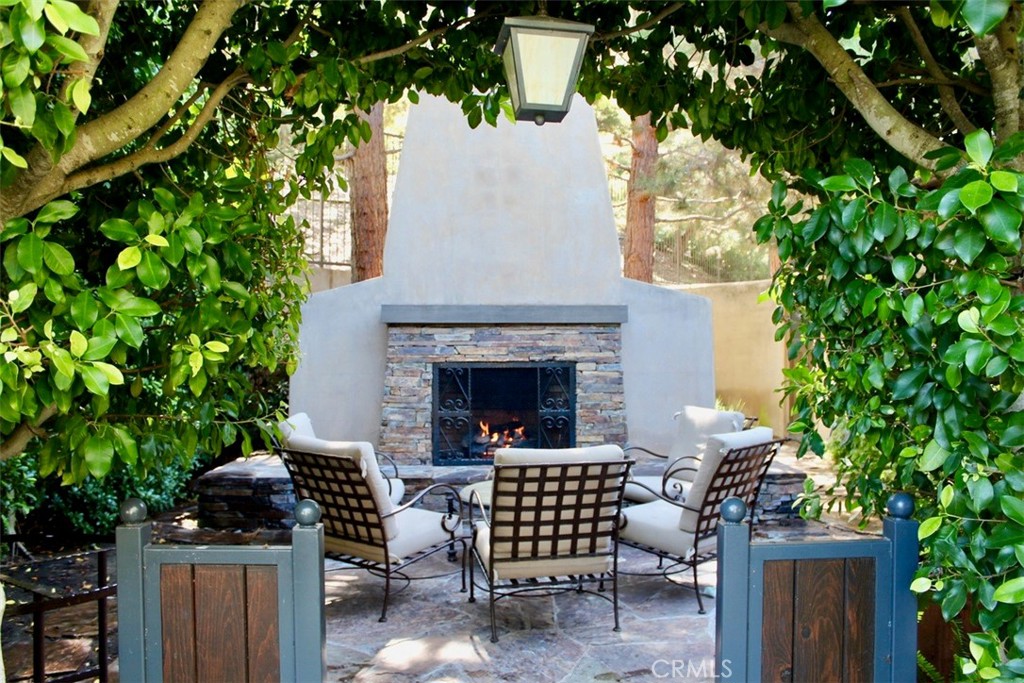 72 Clouds View Irvine, CA 92603 - Photo 32 of 43 a view of a patio with a table and chairs and potted plants