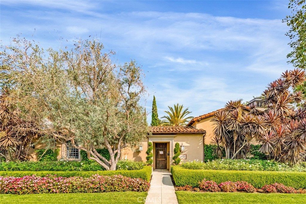72 Clouds View Irvine, CA 92603 - Photo 34 of 43 a front view of a house with a garden
