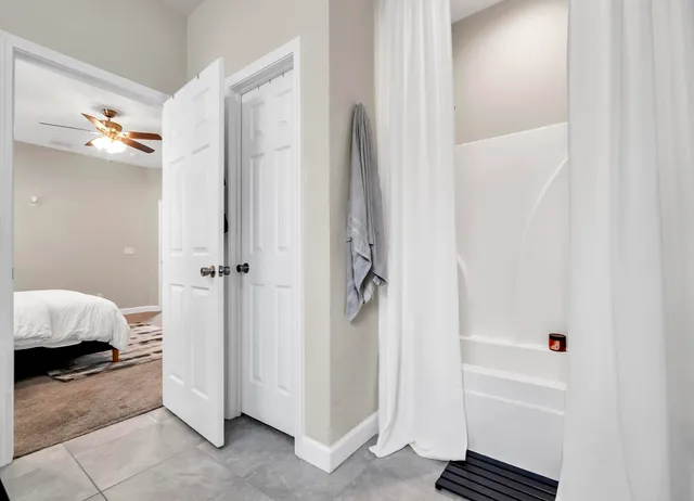 a bathroom with a bathtub and a shower