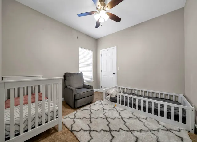 a bedroom with furniture and a window