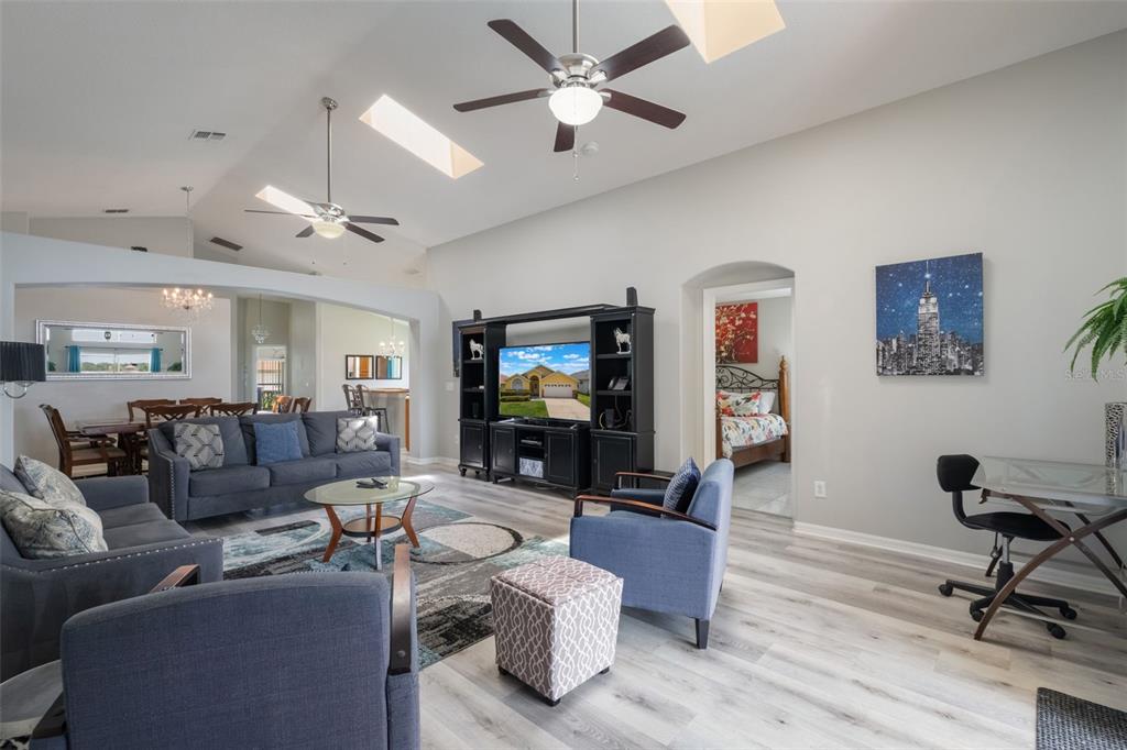 2685 Oneida Loop Kissimmee, FL 34747 - Photo 12 of 54 a living room with furniture and a flat screen tv