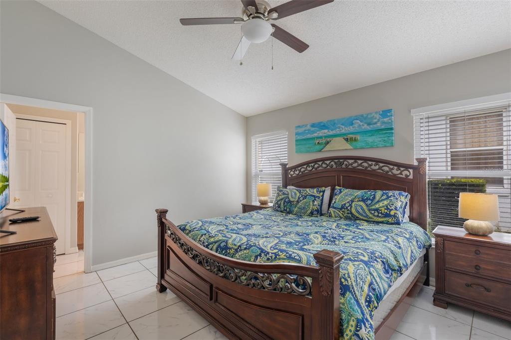 2685 Oneida Loop Kissimmee, FL 34747 - Photo 14 of 54 a bedroom with a bed and window