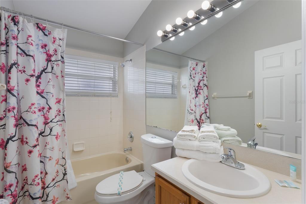 2685 Oneida Loop Kissimmee, FL 34747 - Photo 24 of 54 a bathroom with a sink toilet and shower
