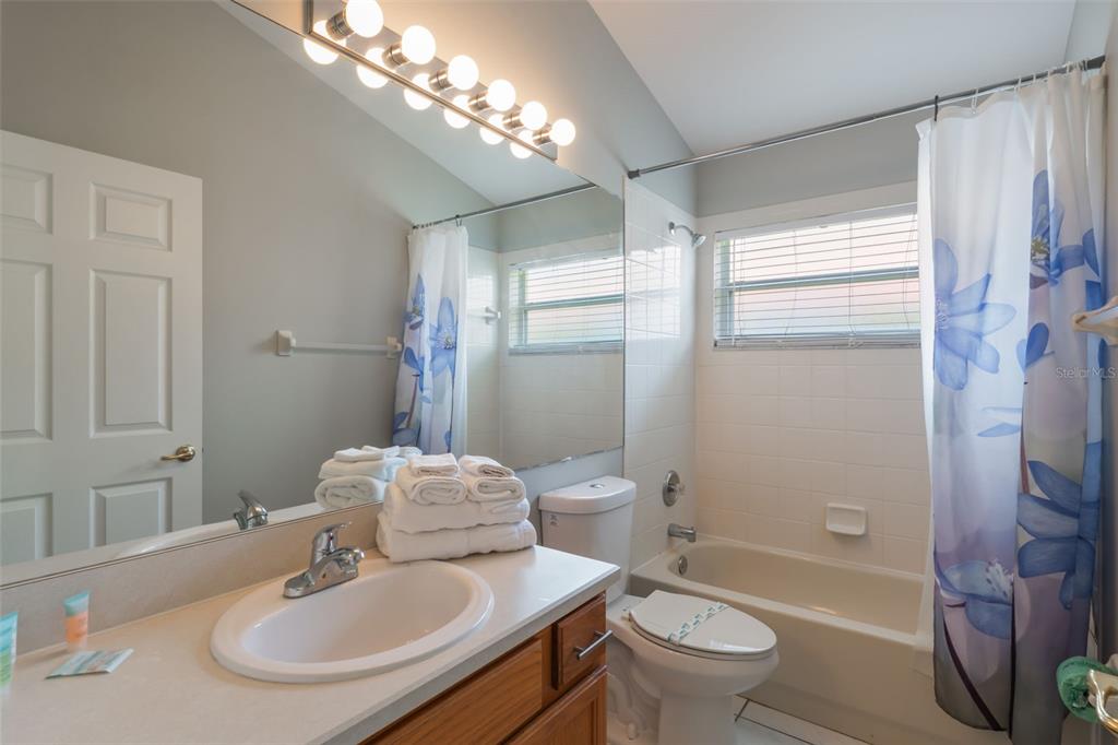 2685 Oneida Loop Kissimmee, FL 34747 - Photo 26 of 54 a bathroom with a sink toilet tub and shower