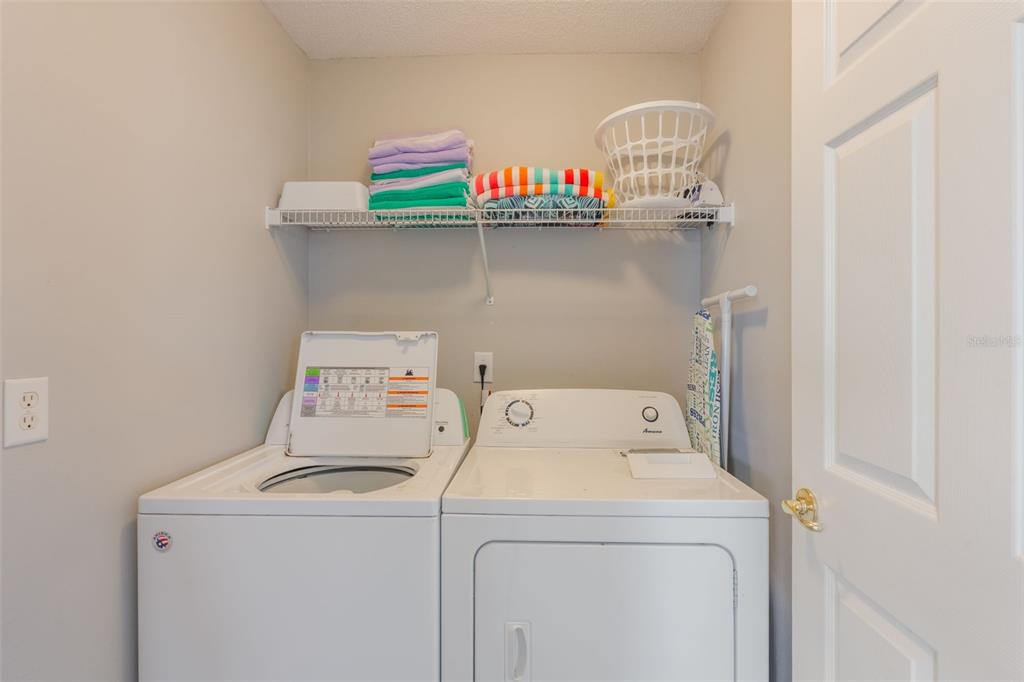 2685 Oneida Loop Kissimmee, FL 34747 - Photo 27 of 54 a utility room with dryer and washer