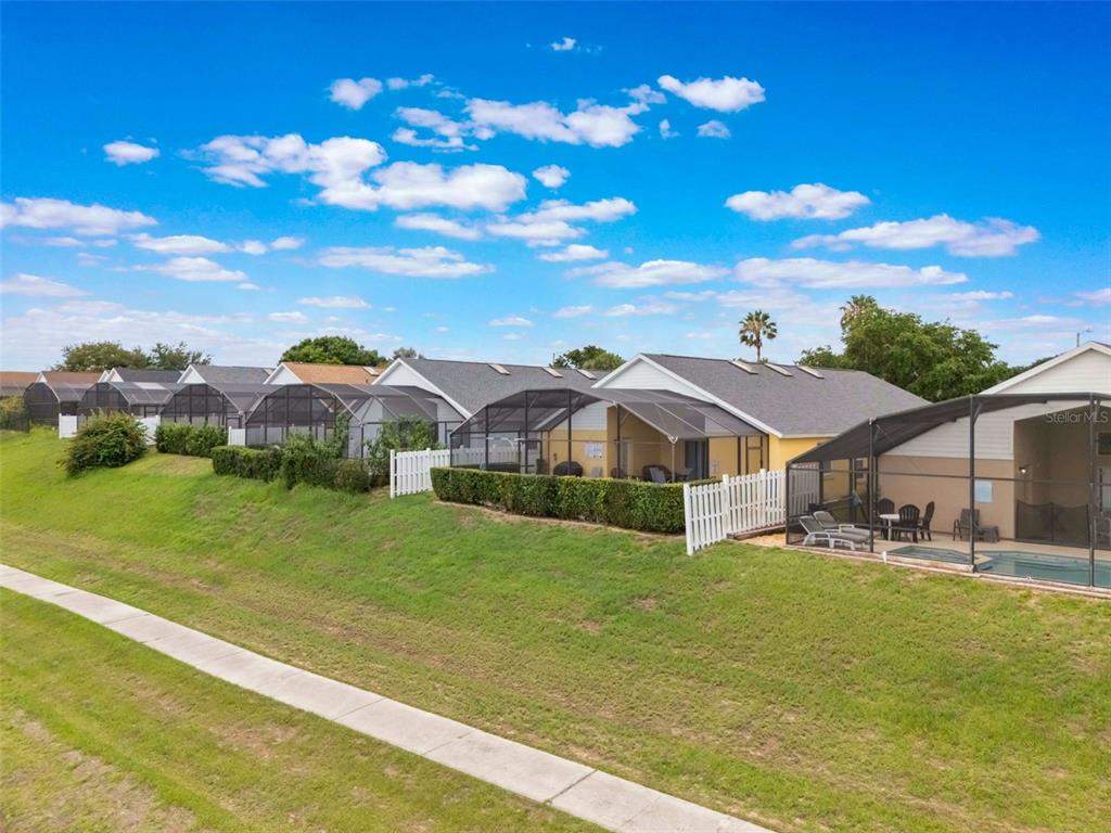 2685 Oneida Loop Kissimmee, FL 34747 - Photo 34 of 54 a view of a house with a yard