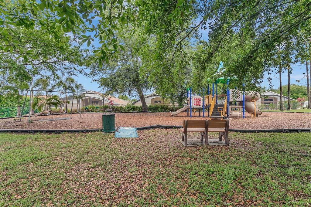 2685 Oneida Loop Kissimmee, FL 34747 - Photo 46 of 54 a view of a park with bench and trees