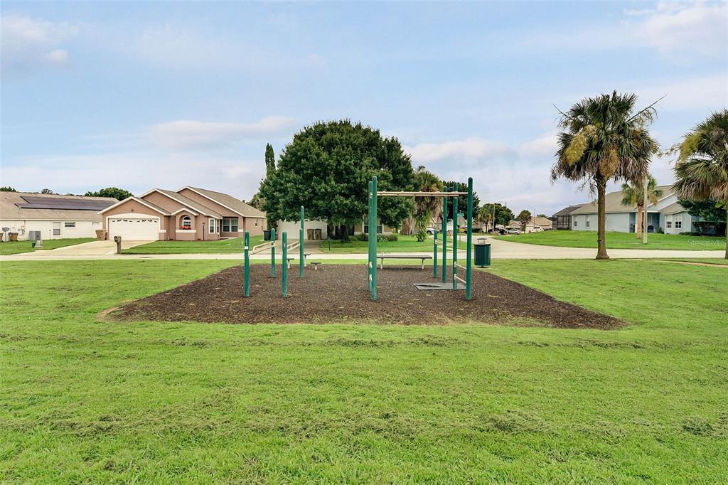 2685 Oneida Loop Kissimmee, FL 34747 - Photo 50 of 54 a view of a park with swings and slides