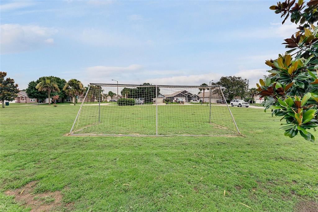 2685 Oneida Loop Kissimmee, FL 34747 - Photo 52 of 54 a view of a park with a big yard