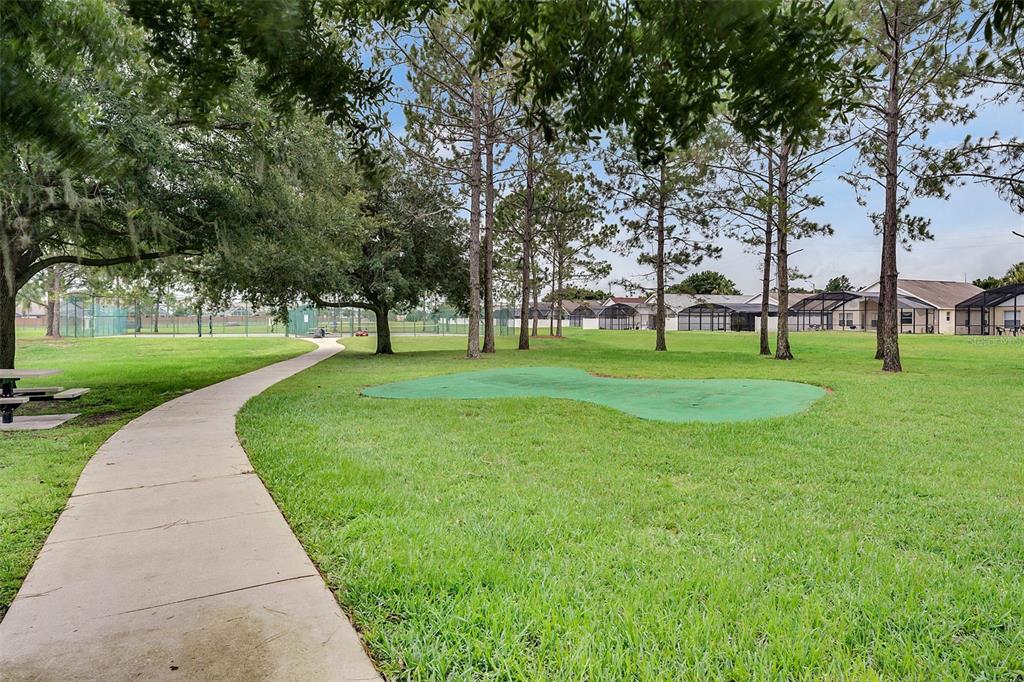 2685 Oneida Loop Kissimmee, FL 34747 - Photo 53 of 54 a huge green field with lots of trees