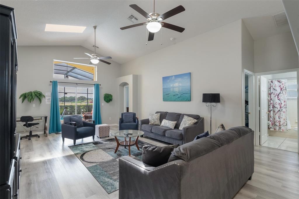 2685 Oneida Loop Kissimmee, FL 34747 - Photo 9 of 54 a living room with furniture and a large window