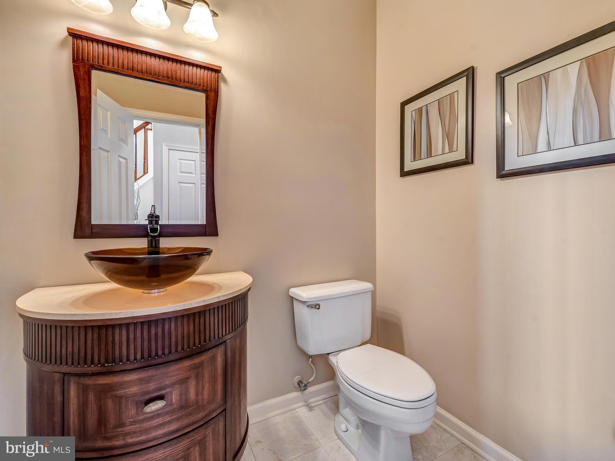 6413 Spring Forest Road Frederick, MD 21701 - Photo 14 of 30 Powder room on main floor has been remodeled.
