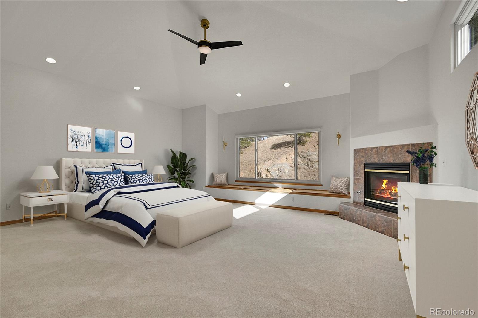 671 Trailside Drive Golden, CO 80401 - Photo 18 of 39 a spacious bedroom with a bed and a couch