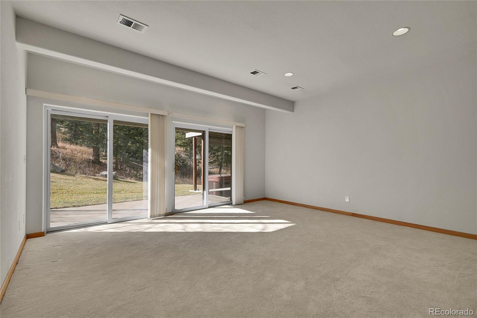 671 Trailside Drive Golden, CO 80401 - Photo 26 of 39 a view of an empty room with glass door and balcony