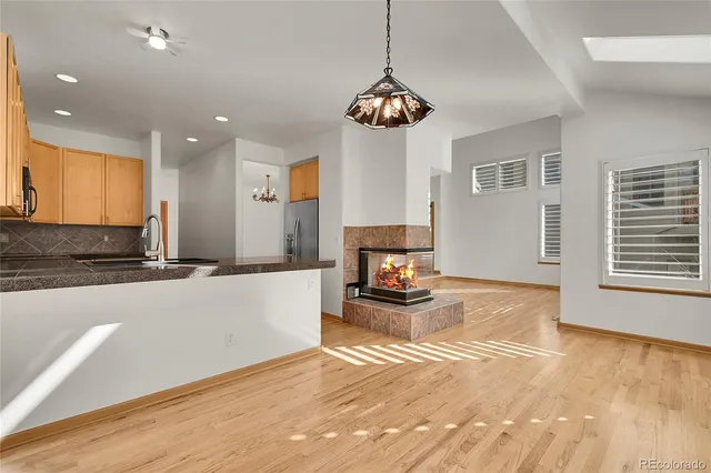 a view of a livingroom with wooden floor and a window