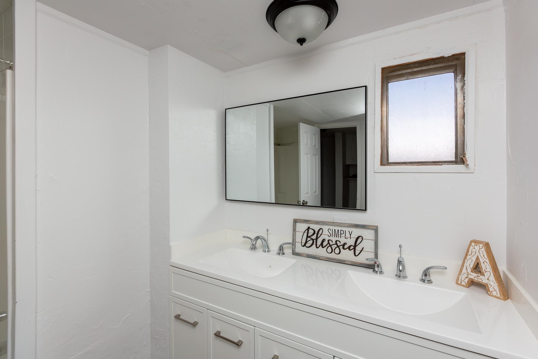 424 32 Road, Unit 112 Clifton, CO 81520 - Photo 23 of 41 a bathroom with a sink and a mirror