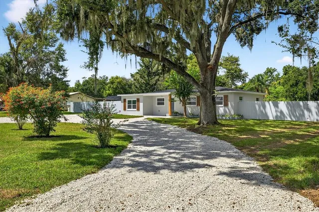 a bathroom with a sink a mirror and shower