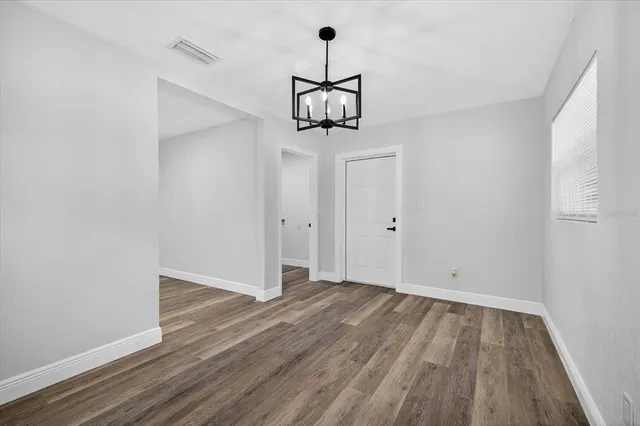 a view of a park with large trees