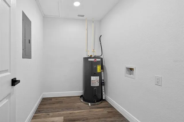 a front view of house with a garden