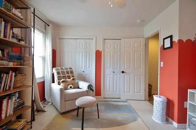 a living room with furniture a lamp and a window