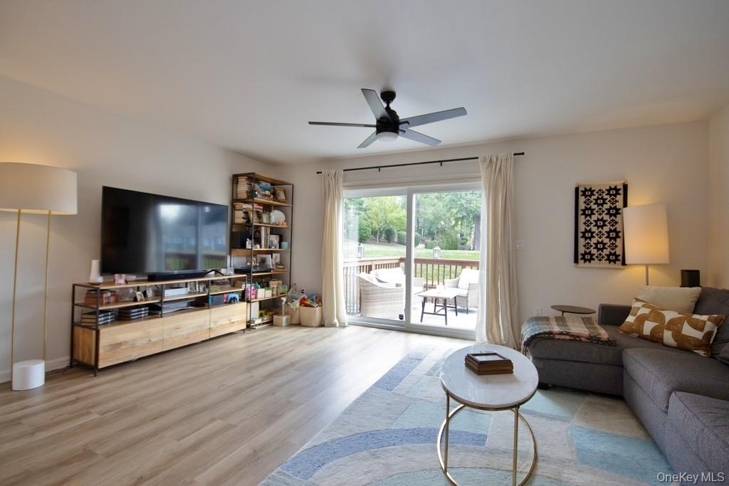 104 Mallard Way Peekskill, NY 10566 - Photo 9 of 26 Living Room has luxury vinyl plank floors and SGD to Deck