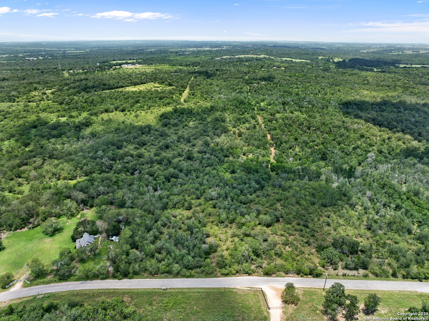 Tbd Burdette Wells Road Lockhart, TX 78644 - Photo 2 of 11 a view of city with lush green forest