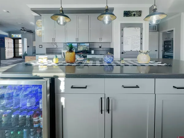 a kitchen with stainless steel appliances granite countertop a sink a counter space and cabinets