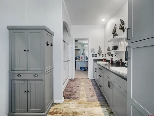 a kitchen with white cabinets