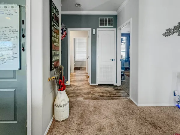 a view of a bedroom with closet and workspace