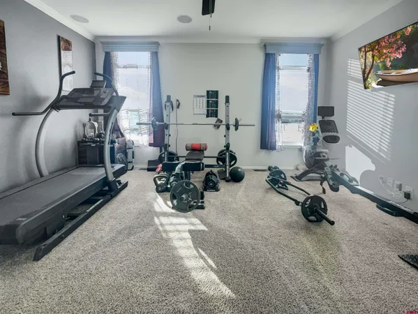 a room with gym equipment and a mirror